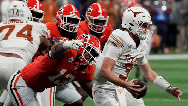 Georgia defensive lineman Mykel Williams (13) goes in for a sack on Texas quarterback Quinn Ewers (3) during the second half of the SEC championship game against Texas in Atlanta, on Saturday, Dec. 7, 2024. Georgia defensive lineman Mykel Williams (13) goes in for a sack on Texas quarterback Quinn Ewers (3) during the second half of the SEC championship game against Texas in Atlanta, on Saturday, Dec. 7, 2024.