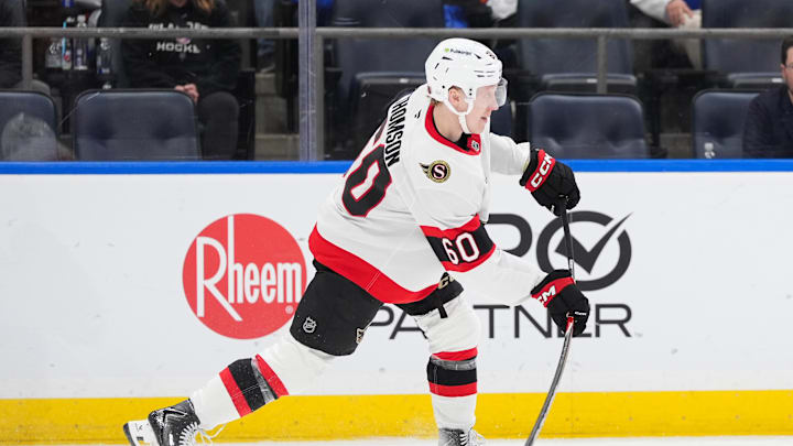 Apr 11, 2026; Elmont, New York, USA; Ottawa Senators defenseman Lassi Thomson (60) passes the puck in the second period at UBS Arena. Mandatory Credit: Alexander Wohl-Imagn Images