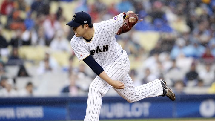 March 21, 2017; Los Angeles, CA, USA; Japan pitcher Tomoyuki Sugano (11) throws against USA in the first inning during the 2017 World Baseball Classic at Dodger Stadium.