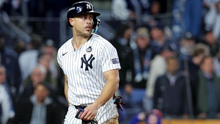 Oct 28, 2024; New York, New York, USA; New York Yankees designated hitter Giancarlo Stanton (27) reacts after being tagged out at home plate during the fourth inning against the Los Angeles Dodgers in game three of the 2024 MLB World Series at Yankee Stadium. Mandatory Credit: Brad Penner-Imagn Images