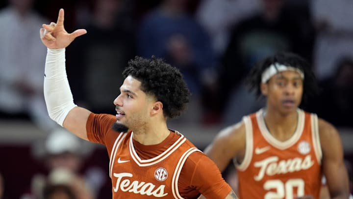 Texas Longhorns guard Jordan Pope (0) celebrates after making a basket during an SEC men's college basketball game between the University of Oklahoma Sooners (OU) and the Texas Longhorns at Lloyd Noble Center in Norman, Okla., Wednesday, Jan. 15, 2025. Texas won 77-73. Texas Longhorns guard Jordan Pope (0) celebrates after making a basket during an SEC men's college basketball game between the University of Oklahoma Sooners (OU) and the Texas Longhorns at Lloyd Noble Center in Norman, Okla., Wednesday, Jan. 15, 2025. Texas won 77-73.