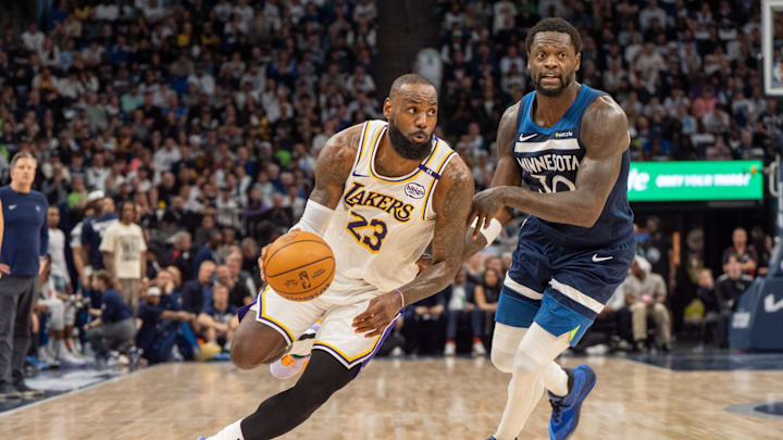 Apr 27, 2025; Minneapolis, Minnesota, USA; Los Angeles Lakers forward LeBron James (23) dribbles past Minnesota Timberwolves forward Julius Randle (30) in the second quarter during game four of first round for the 2025 NBA Playoffs at Target Center. Mandatory Credit: Matt Blewett-Imagn Images Apr 27, 2025; Minneapolis, Minnesota, USA; Los Angeles Lakers forward LeBron James (23) dribbles past Minnesota Timberwolves forward Julius Randle (30) in the second quarter during game four of first round for the 2025 NBA Playoffs at Target Center. Mandatory Credit: Matt Blewett-Imagn Images