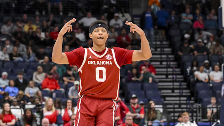 Mar 12, 2025; Nashville, TN, USA;  Oklahoma Sooners guard Jeremiah Fears (0) reacts after a three point basket  against the Georgia Bulldogs during the second half at Bridgestone Arena. Mandatory Credit: Steve Roberts-Imagn Images