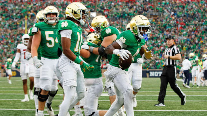 Notre Dame running back Jeremiyah Love (4) celebrates scoring a touchdown during a NCAA college football game between Notre Dame and Louisville at Notre Dame Stadium on Saturday, Sept. 28, 2024, in South Bend.