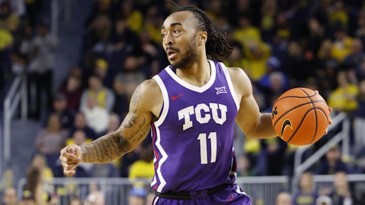Nov 15, 2024; Ann Arbor, Michigan, USA;  TCU Horned Frogs guard Frankie Collins (11) dribbles in the second half against the Michigan Wolverines at Crisler Center. Mandatory Credit: Rick Osentoski-Imagn Images