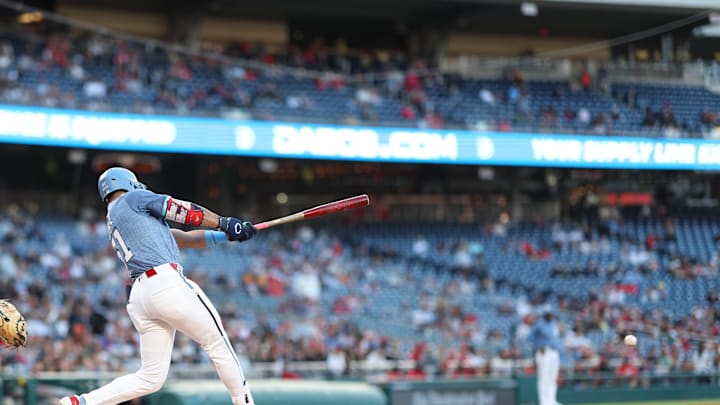 May 23, 2025; Washington, District of Columbia, USA; Washington Nationals right fielder Daylen Lyle (51) hits a single in his first Major League at-bat, against the San Francisco Giants, during the third inning at Nationals Park. May 23, 2025; Washington, District of Columbia, USA; Washington Nationals right fielder Daylen Lyle (51) hits a single in his first Major League at-bat, against the San Francisco Giants, during the third inning at Nationals Park.