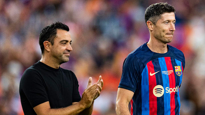 Xavi Hernández (left) was Barcelona’s manager when Robert Lewandowski joined the club.