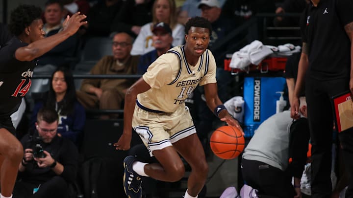 Nov 23, 2024; Atlanta, Georgia, USA; Georgia Tech Yellow Jackets guard Kowacie Reeves Jr. (14) dribbles against the Cincinnati Bearcats in the first half at McCamish Pavilion. Mandatory Credit: Brett Davis-Imagn Images