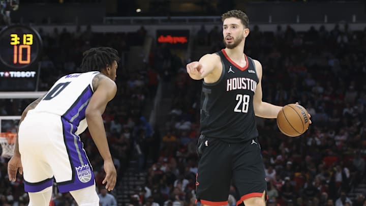 Feb 25, 2026; Houston, Texas, USA; Houston Rockets center Alperen Sengun (28) dribbles the ball as Sacramento Kings guard Malik Monk (0) defends during the second quarter at Toyota Center. Mandatory Credit: Troy Taormina-Imagn Images