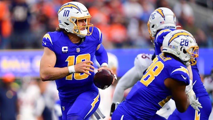 Dec 10, 2023; Inglewood, California, USA; Los Angeles Chargers quarterback Justin Herbert (10) moves
