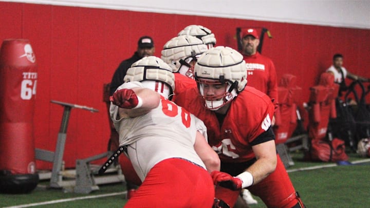 Wisconsin offensive lineman Kerry Kodanko (right) works against Ben Barten (left) during practice on Tuesday April 9, 2024 at the McClain Center in Madison, Wisconsin.