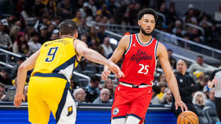 Feb 23, 2025; Indianapolis, Indiana, USA; LA Clippers guard Ben Simmons (25) dribbles the ball while Indiana Pacers guard T.J. McConnell (9) defends in the first half at Gainbridge Fieldhouse. Mandatory Credit: Trevor Ruszkowski-Imagn Images Feb 23, 2025; Indianapolis, Indiana, USA; LA Clippers guard Ben Simmons (25) dribbles the ball while Indiana Pacers guard T.J. McConnell (9) defends in the first half at Gainbridge Fieldhouse. Mandatory Credit: Trevor Ruszkowski-Imagn Images