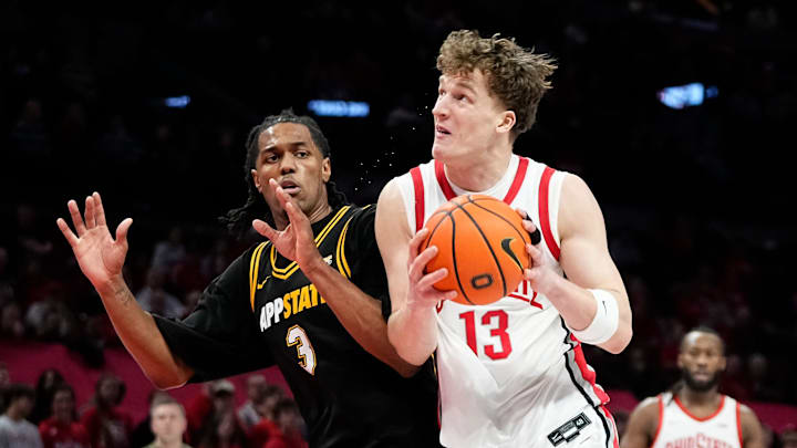 Ohio State Buckeyes center Christoph Tilly (13) drives by Appalachian State Mountaineers center Luke Wilson (3) during the NCAA men's basketball game at Value City Arena in Columbus on Nov. 11, 2025. Ohio State won 75-53.