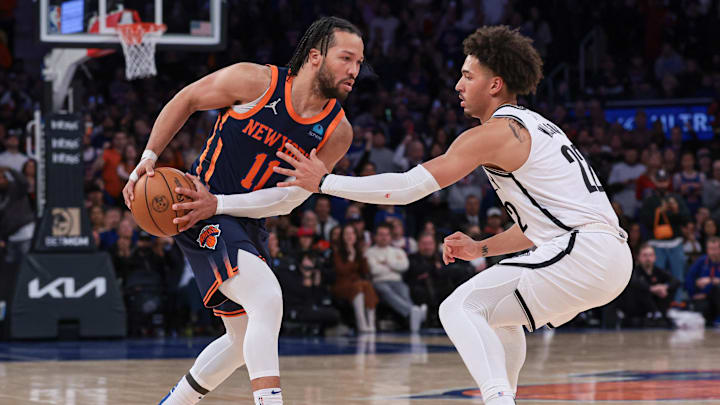 Apr 12, 2024; New York, New York, USA; New York Knicks guard Jalen Brunson (11) shields the ball from Brooklyn Nets forward Jalen Wilson (22) during the second half at Madison Square Garden. Mandatory Credit: Vincent Carchietta-Imagn Images