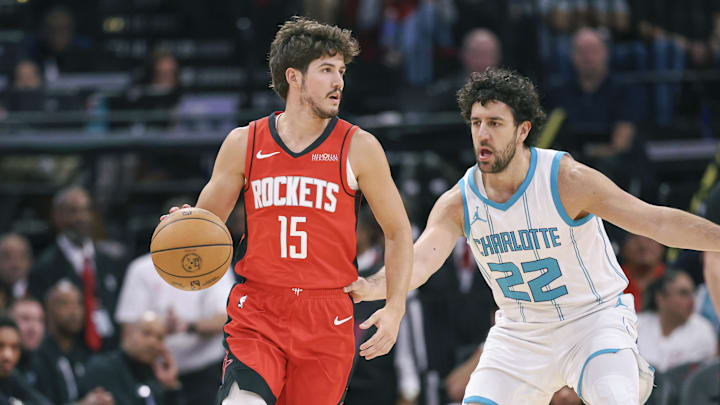Oct 23, 2024; Houston, Texas, USA; Houston Rockets guard Reed Sheppard (15) dribbles the ball as Charlotte Hornets guard Vasilije Micic (22) defends during the game at Toyota Center. Mandatory Credit: Troy Taormina-Imagn Images