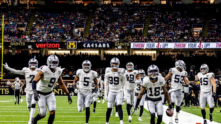 Dec 29, 2024; New Orleans, Louisiana, USA;  Las Vegas Raiders cornerback Jack Jones (18) reacts to intercepting a play from New Orleans Saints quarterback Spencer Rattler (18) during the second half at Caesars Superdome. Mandatory Credit: Stephen Lew-Imagn Images