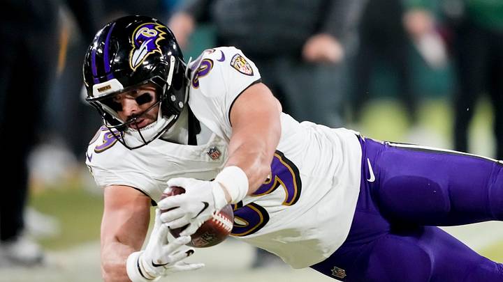 Dec 27, 2025; Green Bay, Wisconsin, USA; Baltimore Ravens tight end Mark Andrews (89) stretches the ball for a first down during the first quarter against the Green Bay Packers at Lambeau Field. Mandatory Credit: Kayla Wolf-Imagn Images