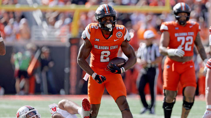 Oklahoma State's Talyn Shettron (2) celebrates a catch in front of Utah's Sione Fotu (12) in the first half of the college football between the Oklahoma State University Cowboys and the Utah Utes at Boone Pickens Stadium in Stillwater, Okla., Saturday, Sept., 21, 2024. Oklahoma State's Talyn Shettron (2) celebrates a catch in front of Utah's Sione Fotu (12) in the first half of the college football between the Oklahoma State University Cowboys and the Utah Utes at Boone Pickens Stadium in Stillwater, Okla., Saturday, Sept., 21, 2024.