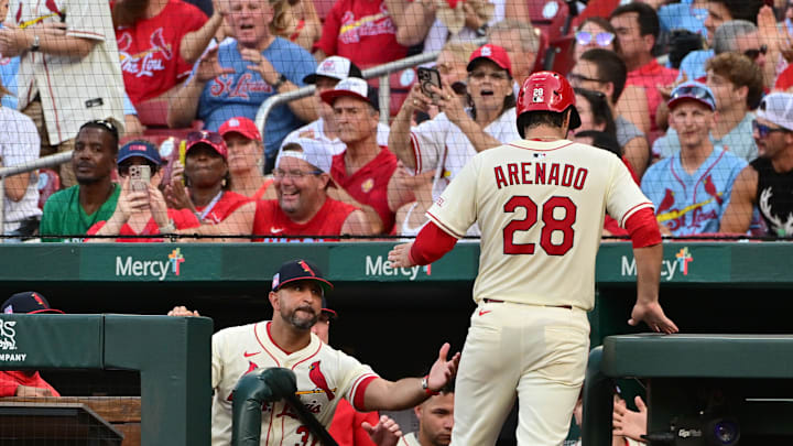 Jul 26, 2025; St. Louis, Missouri, USA; St. Louis Cardinals manager Oliver Marmol (37, left in dugout) congratulates St. Louis Cardinals third baseman Nolan Arenado (28) after he scored in the second inning against the San Diego Padres at Busch Stadium. Mandatory Credit: Tim Vizer-Imagn Images Jul 26, 2025; St. Louis, Missouri, USA; St. Louis Cardinals manager Oliver Marmol (37, left in dugout) congratulates St. Louis Cardinals third baseman Nolan Arenado (28) after he scored in the second inning against the San Diego Padres at Busch Stadium. Mandatory Credit: Tim Vizer-Imagn Images