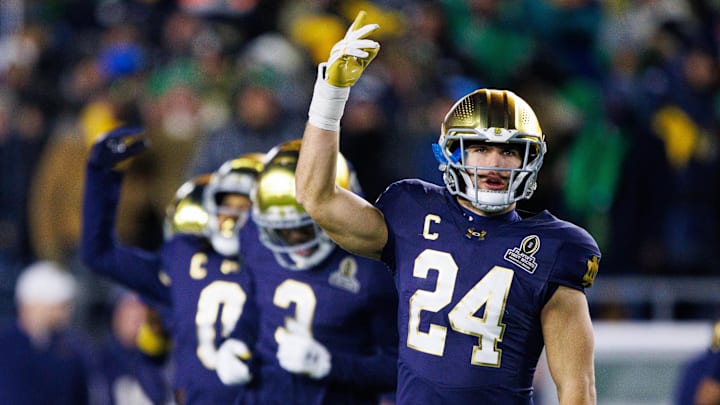 Notre Dame linebacker Jack Kiser (24) hypes up the crowd during the first round of the College Football Playoff between Notre Dame and Indiana at Notre Dame Stadium on Friday, Dec. 20, 2024, in South Bend.