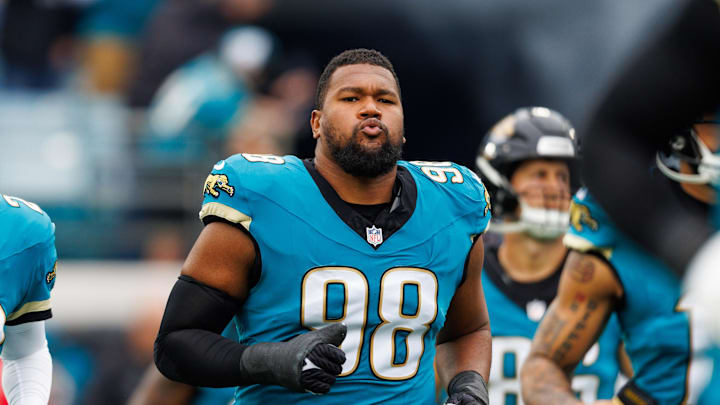 Jan 4, 2026; Jacksonville, Florida, USA; Jacksonville Jaguars defensive end Dawuane Smoot (98) runs out of the tunnel before the game against the Tennessee Titans at EverBank Stadium. Mandatory Credit: Morgan Tencza-Imagn Images
