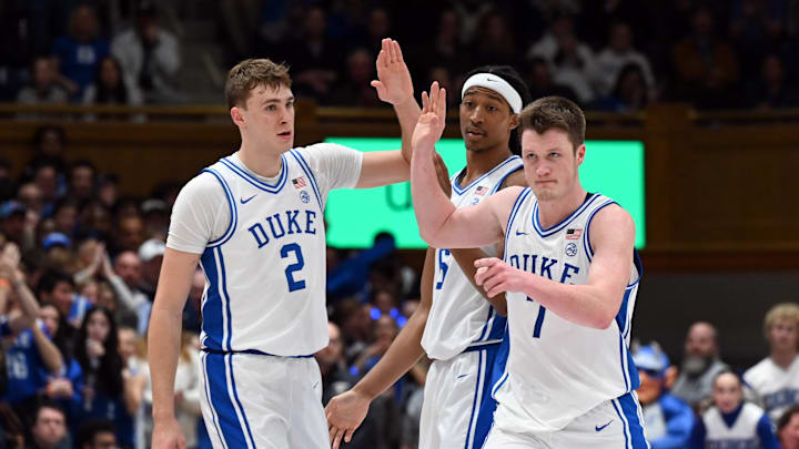 Jan 7, 2025; Durham, North Carolina, USA; Duke basketball forward Kon Knueppel (7) is greeted by teammates after hitting a three-pointer during the second half against the Pitt Panthers at Cameron Indoor Stadium. 