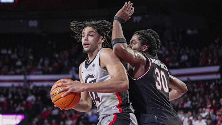 Jan 28, 2025; Athens, Georgia, USA; Georgia Bulldogs forward Asa Newell (14) tries to find room against South Carolina Gamecocks forward Collin Murray-Boyles (30)