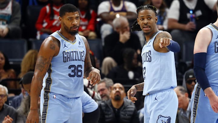 Dec 13, 2024; Memphis, Tennessee, USA; Memphis Grizzlies guard Marcus Smart (36) and guard Ja Morant (12) talk during a time out during the second quarter against the Brooklyn Nets at FedExForum. Mandatory Credit: Petre Thomas-Imagn Images