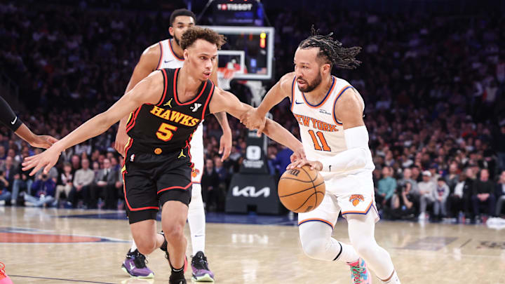 Feb 12, 2025; New York, New York, USA;  New York Knicks guard Jalen Brunson (11) looks to drive past Atlanta Hawks guard Dyson Daniels (5) in the second quarter at Madison Square Garden. Mandatory Credit: Wendell Cruz-Imagn Images