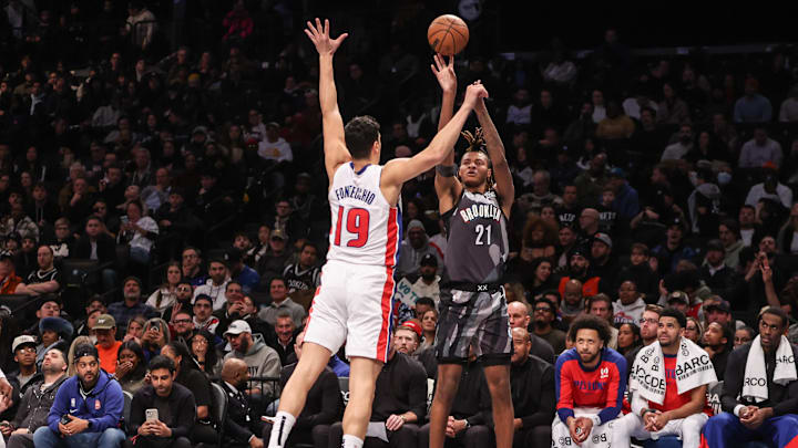 Jan 8, 2025; Brooklyn, New York, USA;  Brooklyn Nets forward Noah Clowney (21) takes a three point shot past Detroit Pistons forward Simone Fontecchio (19) in the fourth quarter at Barclays Center. Mandatory Credit: Wendell Cruz-Imagn Images