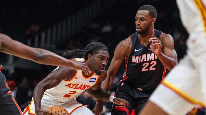 Oct 13, 2025; Atlanta, Georgia, USA; Atlanta Hawks guard Keaton Wallace (2) drives the ball towards the basket against Miami Heat forward Andrew Wiggins (22) during the first quarter at State Farm Arena. Mandatory Credit: Jordan Godfree-Imagn Images Oct 13, 2025; Atlanta, Georgia, USA; Atlanta Hawks guard Keaton Wallace (2) drives the ball towards the basket against Miami Heat forward Andrew Wiggins (22) during the first quarter at State Farm Arena. Mandatory Credit: Jordan Godfree-Imagn Images