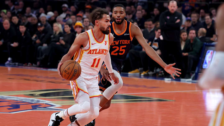 Dec 11, 2024; New York, New York, USA; Atlanta Hawks guard Trae Young (11) controls the ball against New York Knicks forward Mikal Bridges (25) during the first quarter at Madison Square Garden. Mandatory Credit: Brad Penner-Imagn Images