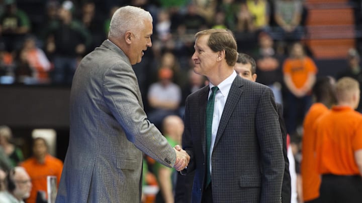 Mar 4, 2017; Corvallis, OR, USA; Oregon State Beavers head coach Wayne Tinkle, left, and Oregon Ducks head coach Dana Altman shake hands before the start of a game at Gill Coliseum. The Ducks won 80-59. Mandatory Credit: Troy Wayrynen-Imagn Images