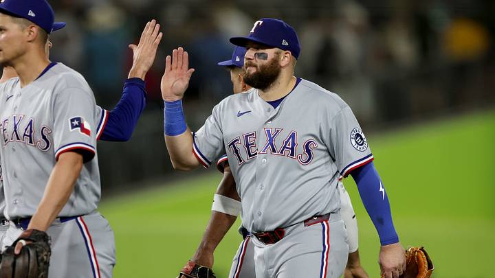 Texas Rangers first baseman Jake Burger (21) high-fives teammates. Credit: Dennis Lee-Imagn Images Texas Rangers first baseman Jake Burger (21) high-fives teammates. Credit: Dennis Lee-Imagn Images