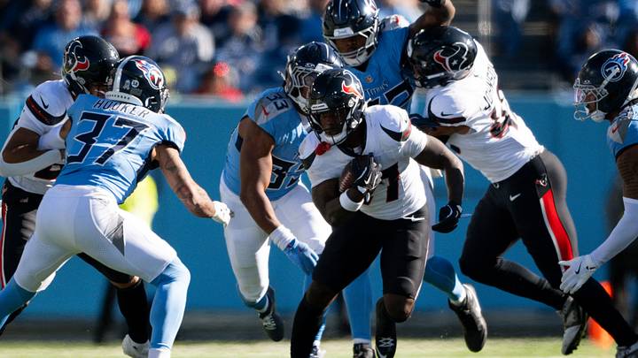 Nov 16, 2025; Nashville, Tennessee, USA;  Houston Texans running back Woody Marks (27) runs with the ball against the Tennessee Titans during the first half at Nissan Stadium. Mandatory Credit: Steve Roberts-Imagn Images