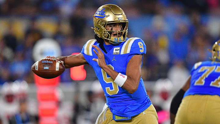 Nov 8, 2025; Pasadena, California, USA; UCLA Bruins quarterback Nico Iamaleava (9) throws against the Nebraska Cornhuskers during the first half at the Rose Bowl. Mandatory Credit: Gary A. Vasquez-Imagn Images