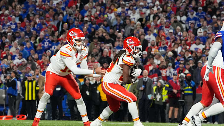 Nov 2, 2025; Orchard Park, New York, USA; Kansas City Chiefs running back Elijah Mitchell (25) recieves a handoff from quarterback Patrick Mahomes (15) in the second quarter at Highmark Stadium. Mandatory Credit: Gregory Fisher-Imagn Images