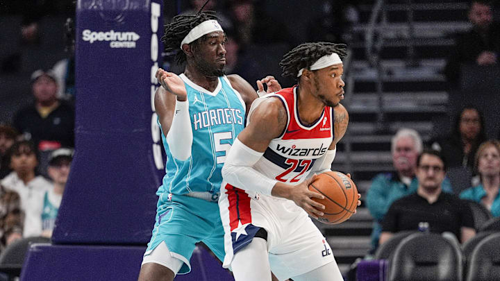 Feb 3, 2025; Charlotte, North Carolina, USA; Washington Wizards forward Richaun Holmes (22) works the ball against Charlotte Hornets center Mark Williams (5) during the first half at Spectrum Center. Mandatory Credit: Jim Dedmon-Imagn Images