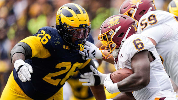 Michigan defensive lineman Rayshaun Benny (26) tries to tackle Central Michigan running back Trey Cornist (6) during the second half at Michigan Stadium in Ann Arbor on Saturday, Sept. 13, 2025. Michigan defensive lineman Rayshaun Benny (26) tries to tackle Central Michigan running back Trey Cornist (6) during the second half at Michigan Stadium in Ann Arbor on Saturday, Sept. 13, 2025.