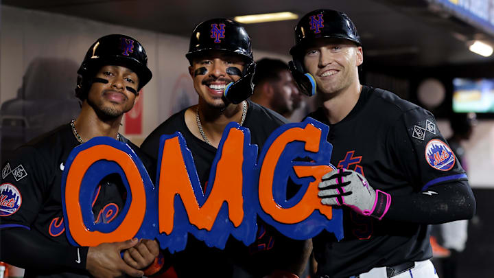 Aug 16, 2024; New York City, New York, USA; New York Mets left fielder Brandon Nimmo (9) celebrates his three run home run against the Miami Marlins with shortstop Francisco Lindor (12) and third baseman Mark Vientos (27) during the fourth inning at Citi Field. Mandatory Credit: Brad Penner-USA TODAY Sports