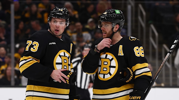 Mar 24, 2026; Boston, Massachusetts, USA; Boston Bruins defenseman Charlie McAvoy (73) talks with right wing David Pastrnak (88) during the third period against the Toronto Maple Leafs at TD Garden. Mandatory Credit: Winslow Townson-Imagn Images