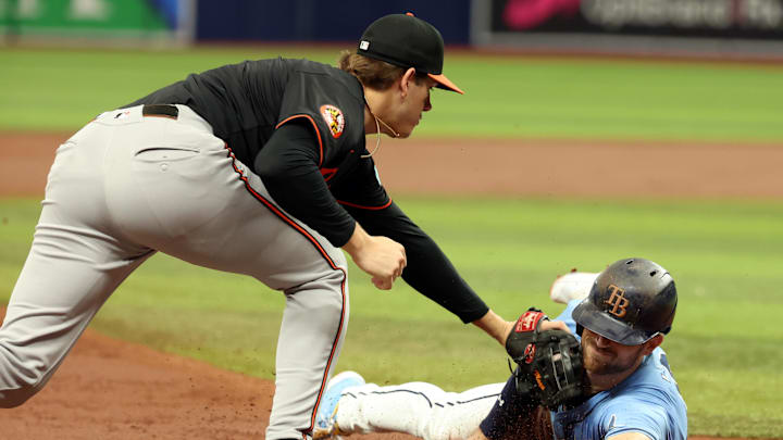 Aug 11, 2024; St. Petersburg, Florida, USA; Baltimore Orioles third base Coby Mayo (16) tags out Tampa Bay Rays designated hitter Brandon Lowe (8) at third base during the third inning at Tropicana Field. Aug 11, 2024; St. Petersburg, Florida, USA; Baltimore Orioles third base Coby Mayo (16) tags out Tampa Bay Rays designated hitter Brandon Lowe (8) at third base during the third inning at Tropicana Field.