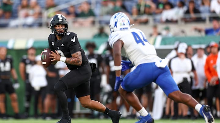 Oct 12, 2024; Orlando, Florida, USA; South Florida Bulls quarterback Bryce Archie (3) drops back to pass pressured by Memphis Tigers linebacker Bryce Edmondson (44) in the fourth quarter  at Camping World Stadium. Mandatory Credit: Nathan Ray Seebeck-Imagn Images