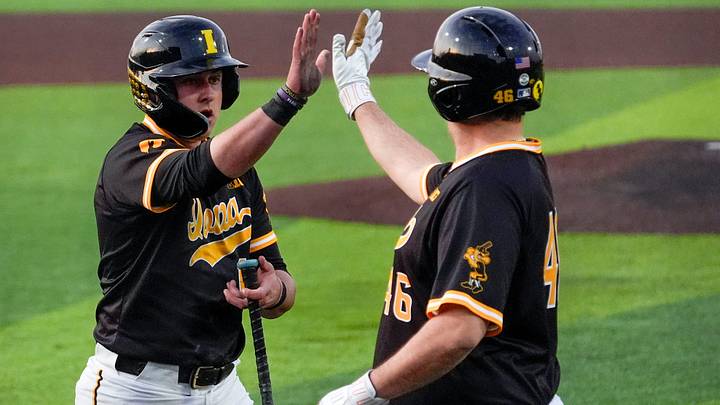 Iowa first baseman Caleb Wulf (1) gets a high five after scoring against Bradley April 16, 2025 at Duane Banks Field in Iowa City, Iowa.