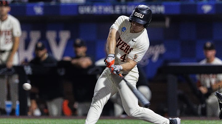 Jun 9, 2024; Lexington, KY, USA; Oregon State Beavers infielder Dallas Macias (4) hits a pitch during the fourth inning against the Kentucky Wildcats at Kentucky Proud Park. Mandatory Credit: Jordan Prather-Imagn Images