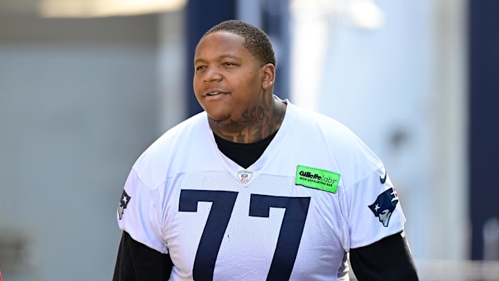 Jul 26, 2023; Foxborough, MA, USA; New England Patriots offensive tackle Trent Brown (77) makes his way to the practice fields for  training camp at Gillette Stadium. Mandatory Credit: Eric Canha-Imagn Images