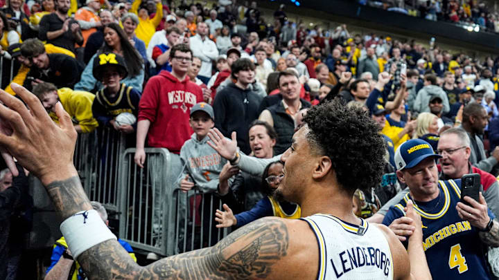 Michigan forward Yaxel Lendeborg (23) high-fives fans to celebrate 90-77 win over Alabama at the NCAA Tournament Sweet 16 round at United Center in Chicago on Friday, March 27, 2026.