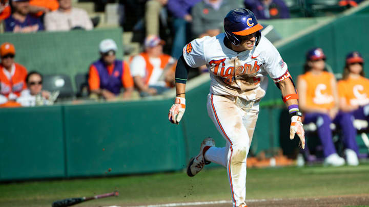 Clemson junior Andrew Ciufo (5) drops the bat as he runs to first base