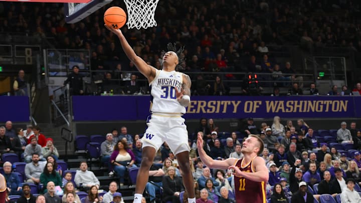 Feb 14, 2026; Seattle, Washington, USA; Washington Huskies guard Courtland Muldrew (30) shoots the ball against the Minnesota Golden Gophers during the first half at Alaska Airlines Arena at Hec Edmundson Pavilion. Mandatory Credit: Steven Bisig-Imagn Images