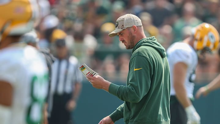 Green Bay Packers quarterbacks coach Sean Mannion reviews his practice schedule during practice on Friday, August 1, 2025, at Ray Nitschke Field in Ashwaubenon, Wis. 